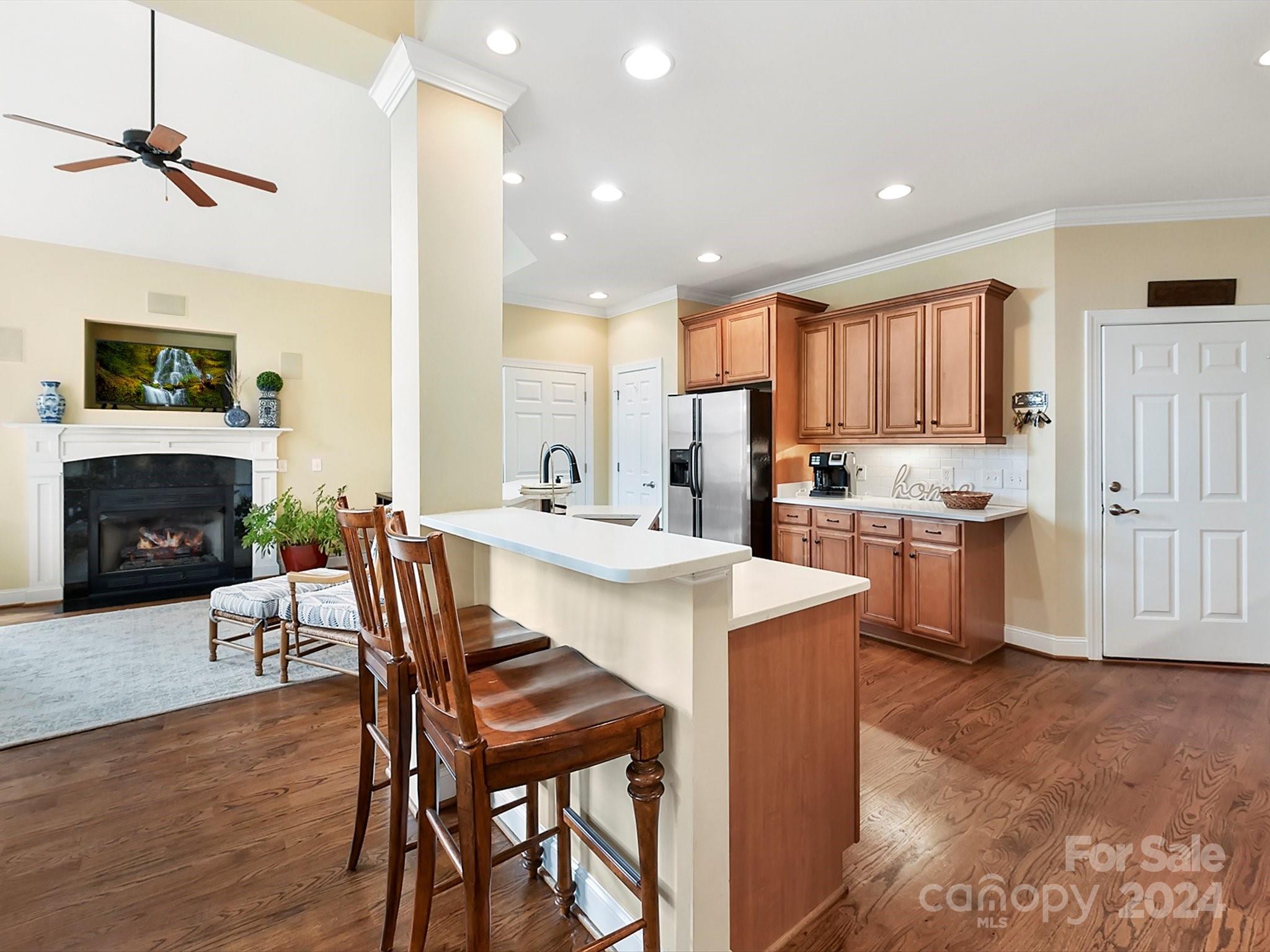 146 Canterbury Crossing Fort Mill, SC 29708 - Photo 14 of 48 a kitchen with a table chairs refrigerator and cabinets