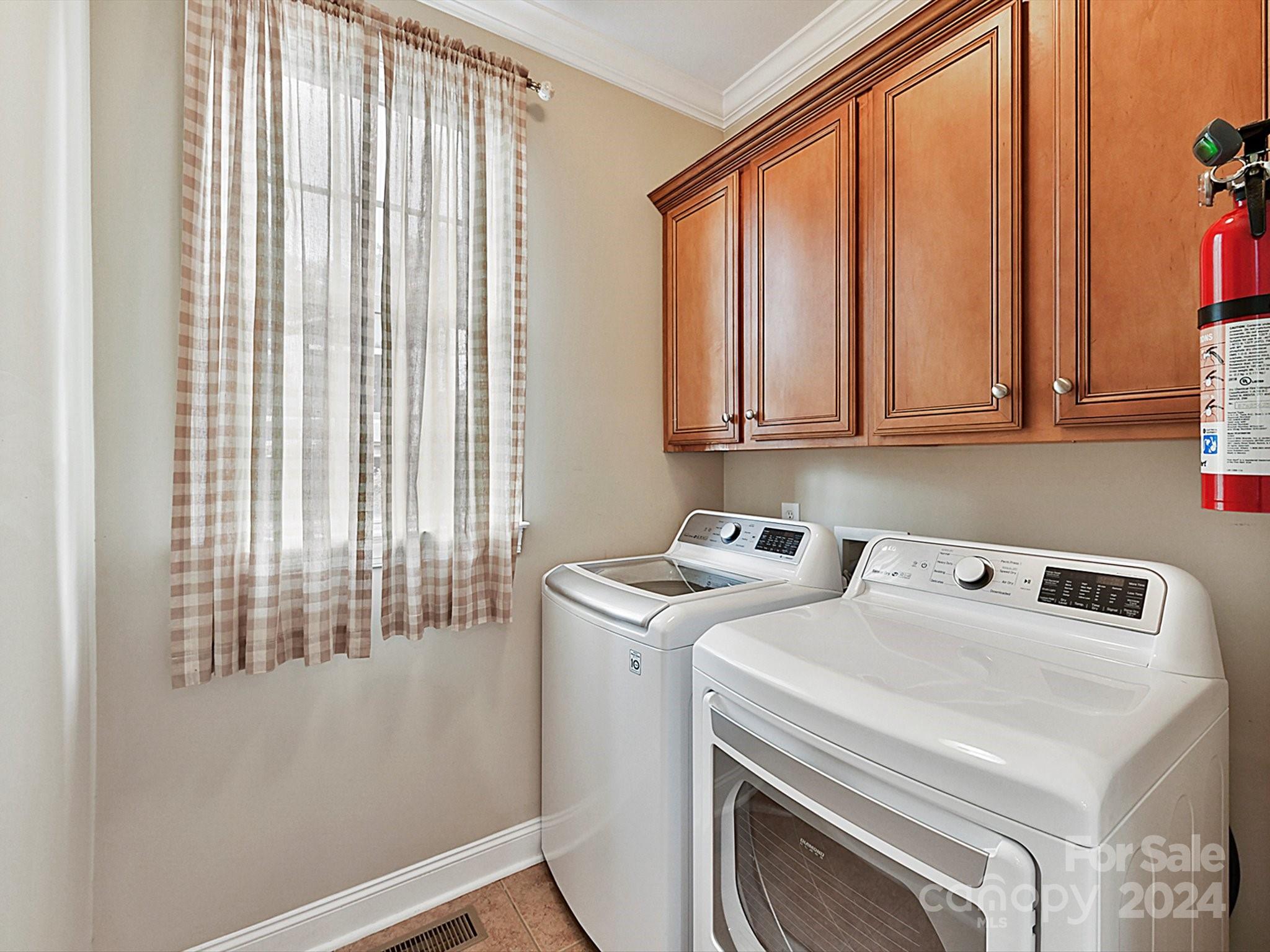 146 Canterbury Crossing Fort Mill, SC 29708 - Photo 18 of 48 a utility room with dryer and washer