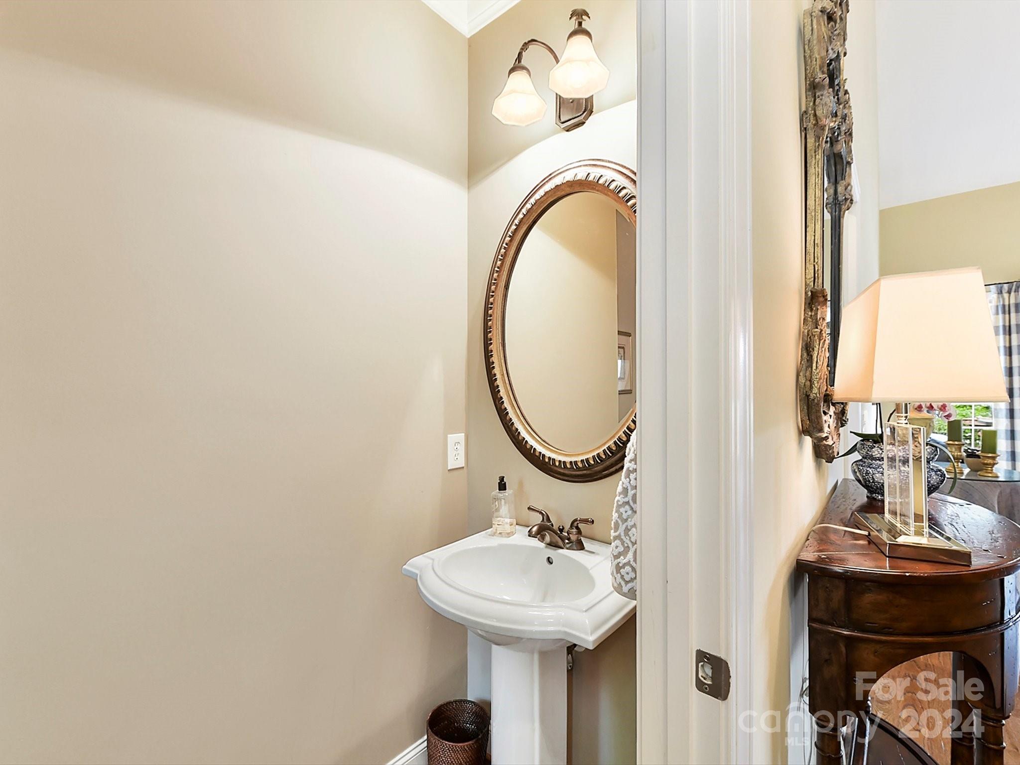 146 Canterbury Crossing Fort Mill, SC 29708 - Photo 19 of 48 a bathroom with a sink and a mirror
