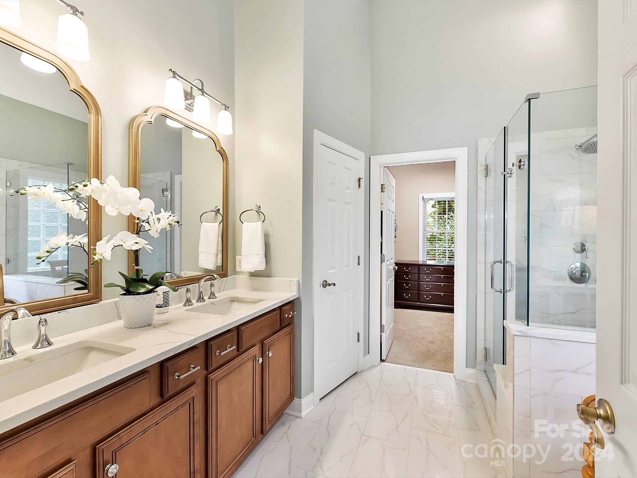 146 Canterbury Crossing Fort Mill, SC 29708 - Photo 22 of 48 a spacious bathroom with a double vanity sink mirror and shower