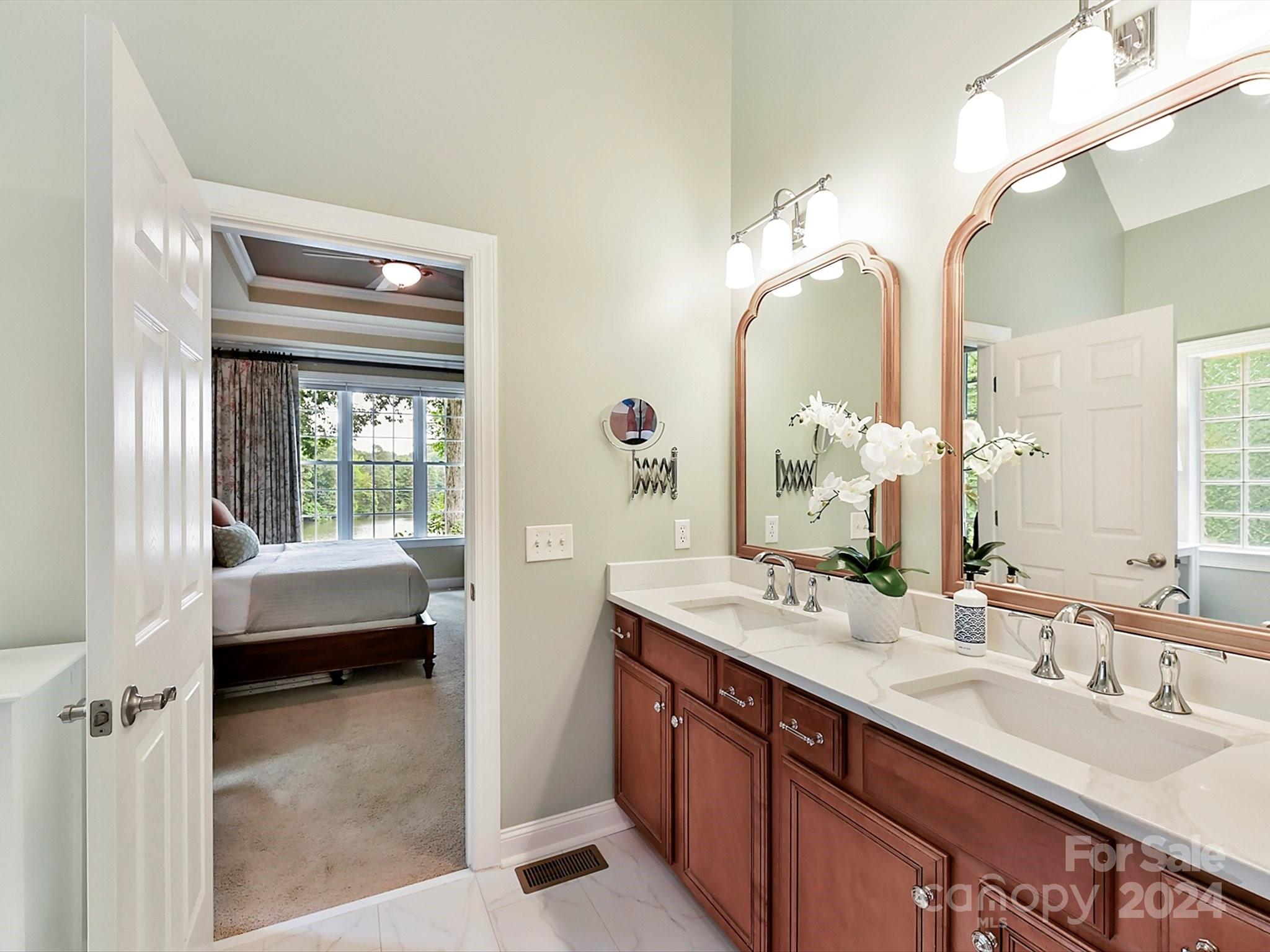146 Canterbury Crossing Fort Mill, SC 29708 - Photo 24 of 48 a en suite bathroom with a double vanity sink tub and mirror