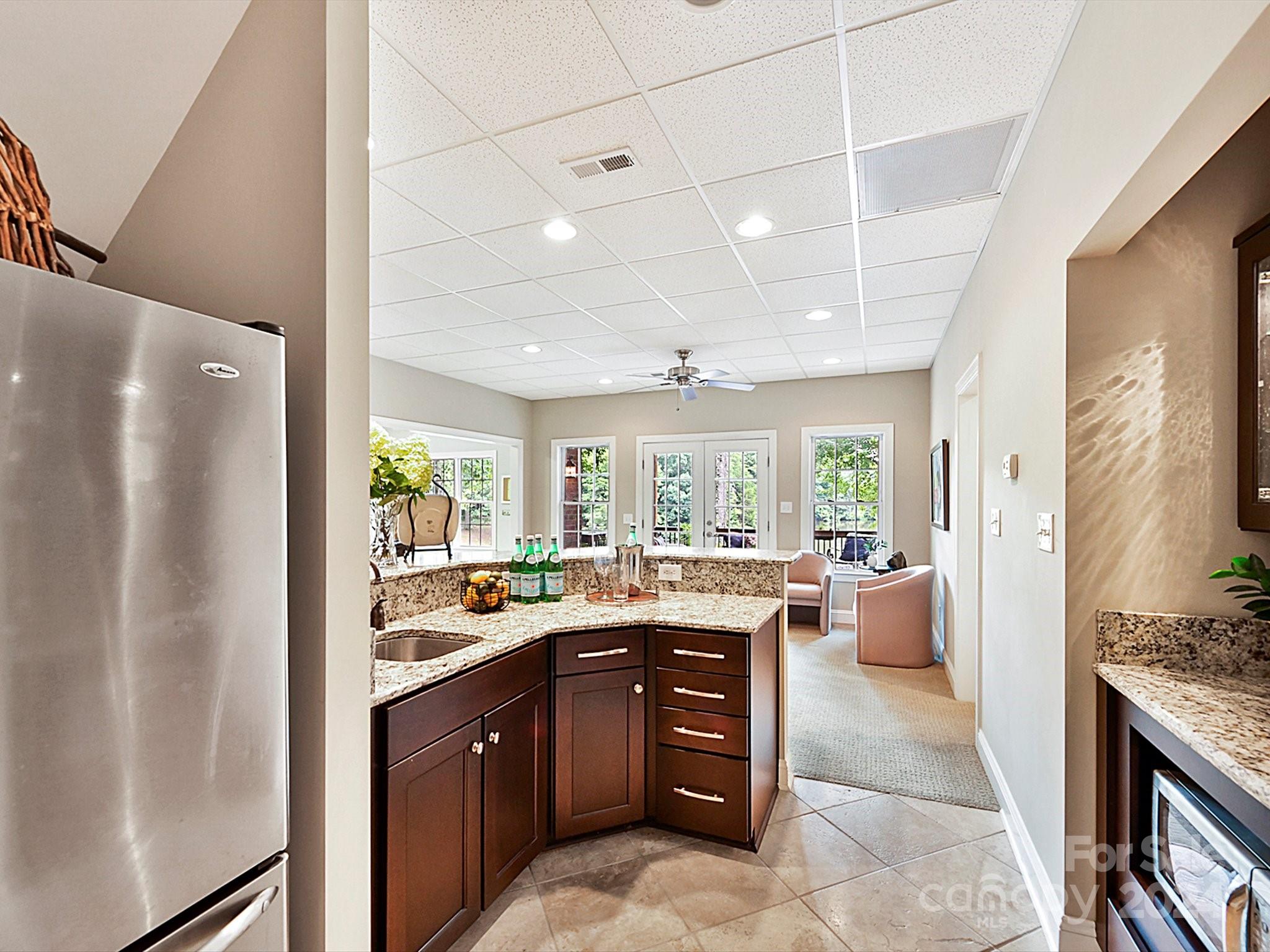 146 Canterbury Crossing Fort Mill, SC 29708 - Photo 35 of 48 a kitchen with a sink stove and cabinets