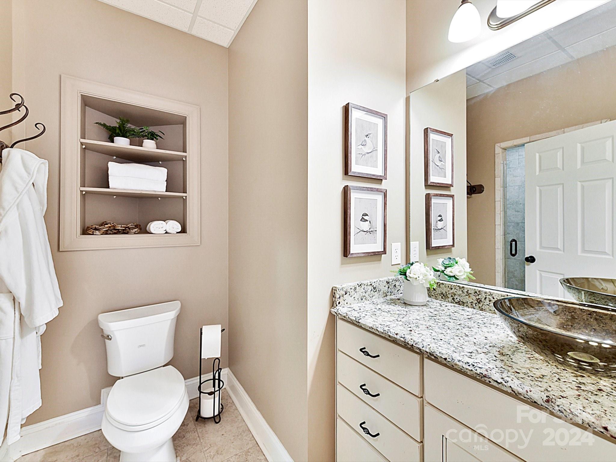 146 Canterbury Crossing Fort Mill, SC 29708 - Photo 38 of 48 a bathroom with a granite countertop toilet sink and mirror