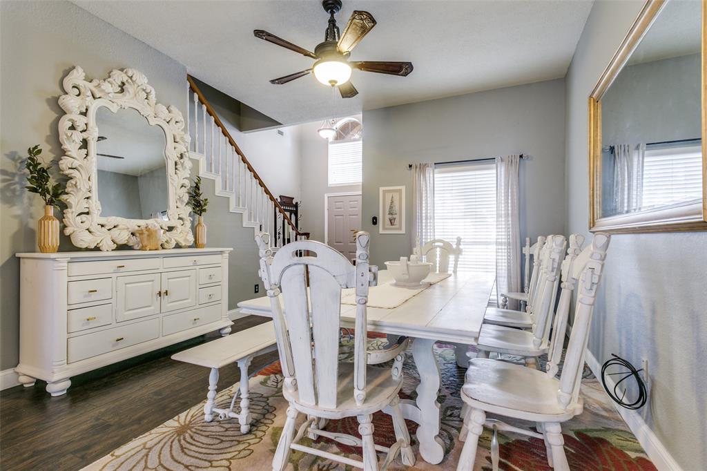 2133 Rim Rock Drive Keller, TX 76248 - Photo 11 of 37 Dining room featuring dark wood finished floors, a ceiling fan, and stairs