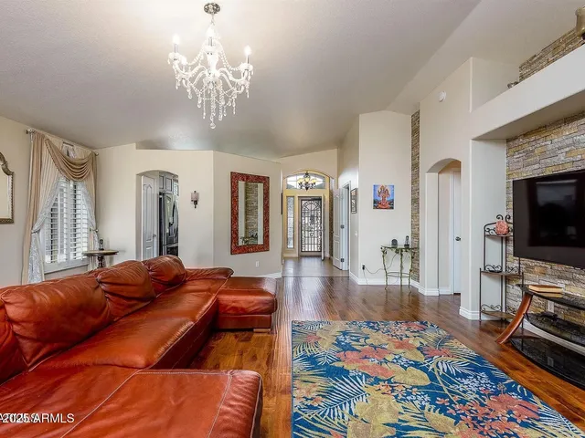 a bedroom with a bed and flat screen tv