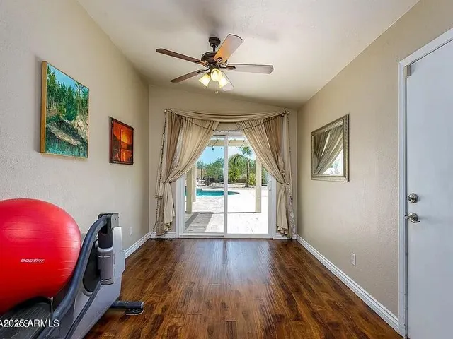 a view of a livingroom with furniture wooden floor chandelier