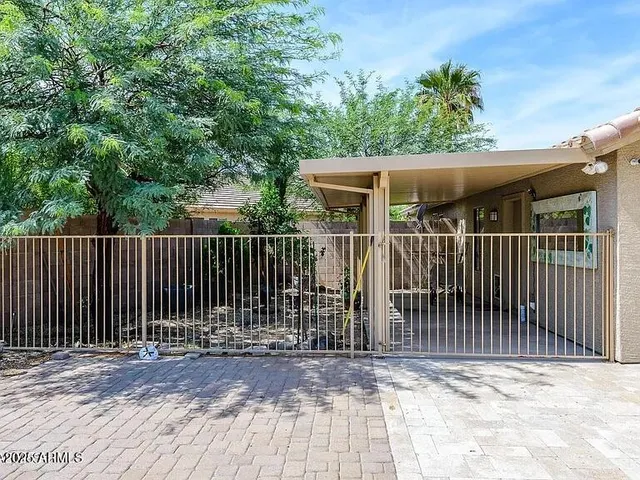 a view of a house with a small yard