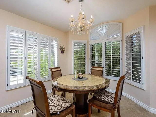 a view of a dining room with furniture window and outside view