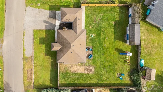 an aerial view of a residential houses with swimming pool