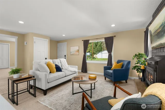 a living room with furniture and a potted plant