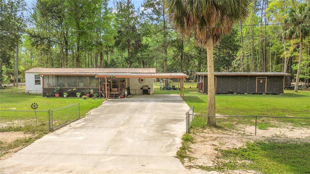 3650 176 Place Inglis, FL 34449 - Photo 7 of 49 a view of house with a yard