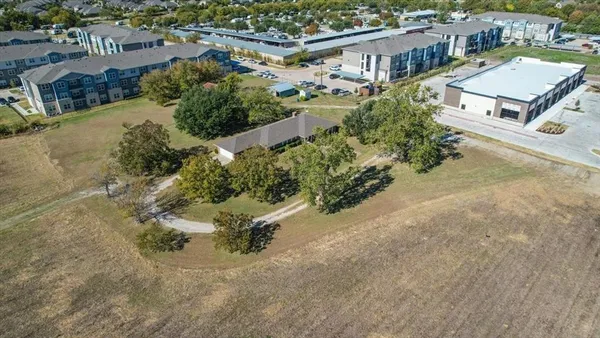 an aerial view of residential building and lake