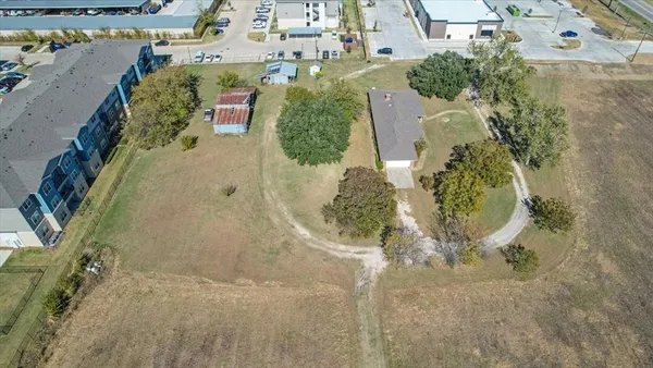 an aerial view of a house with outdoor space