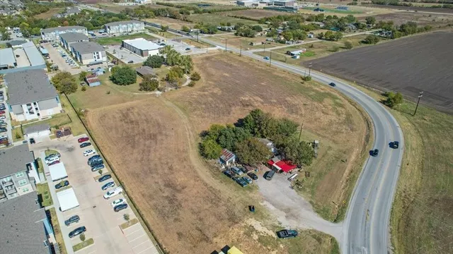 an aerial view of a swimming pool with outdoor space