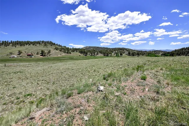 a view of a road with an ocean beach