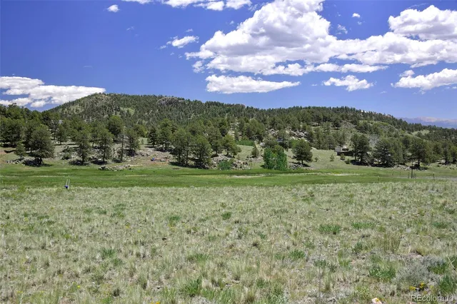 a view of a town with mountains in the background