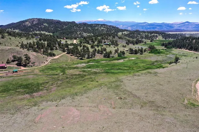 a view of a town with mountains in the background