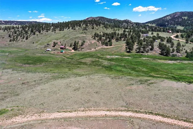 a view of a town with trees