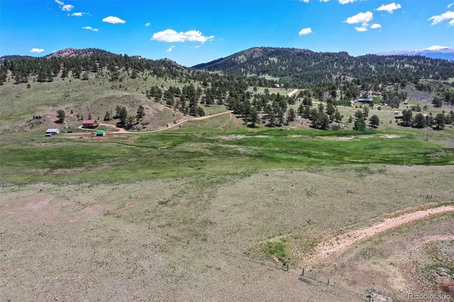 a view of a town with mountains in the background