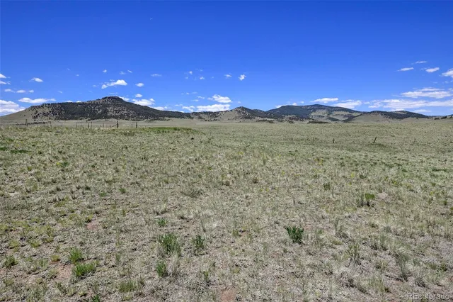a view of a golf course with a lake