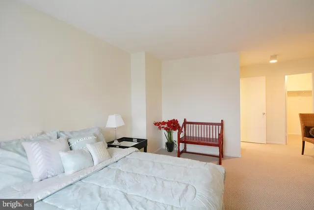 a bedroom with a bed and furniture