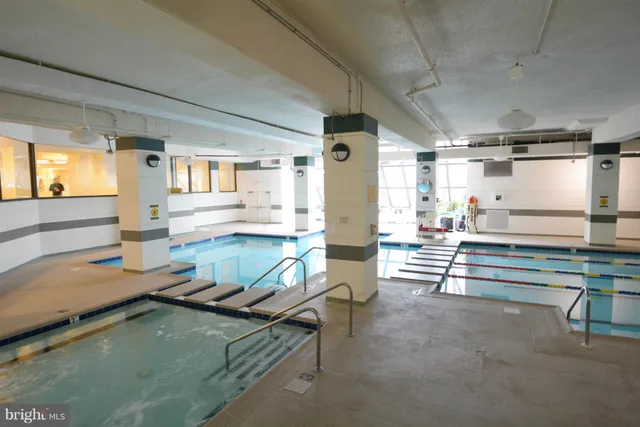 a kitchen with counter top space and windows