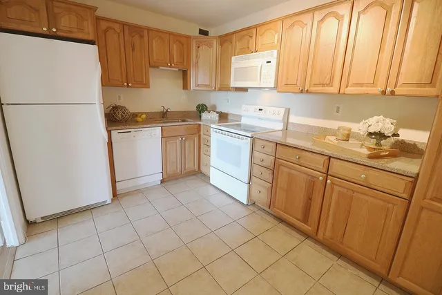 a kitchen with sink cabinets and window