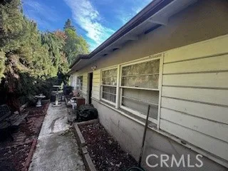 a view of a chairs and table in the balcony