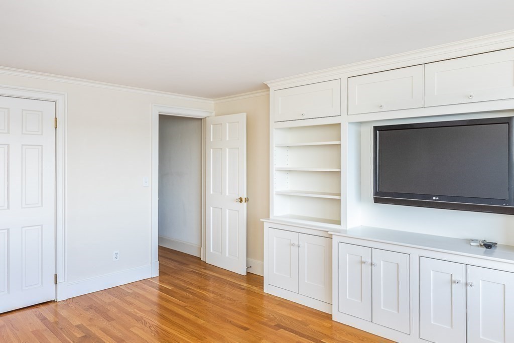 147 Front Street, Unit 6 Marblehead, MA 01945 - Photo 13 of 25 a view of a livingroom with an empty space and wooden floor