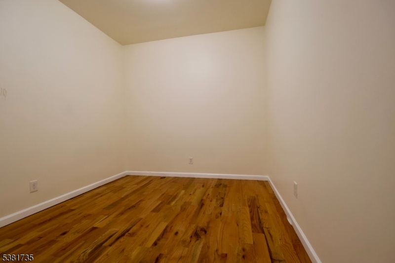 112 Chadwick Avenue, Unit 2 Newark, NJ 07108 - Photo 12 of 13 a view of wooden floor in a bathroom