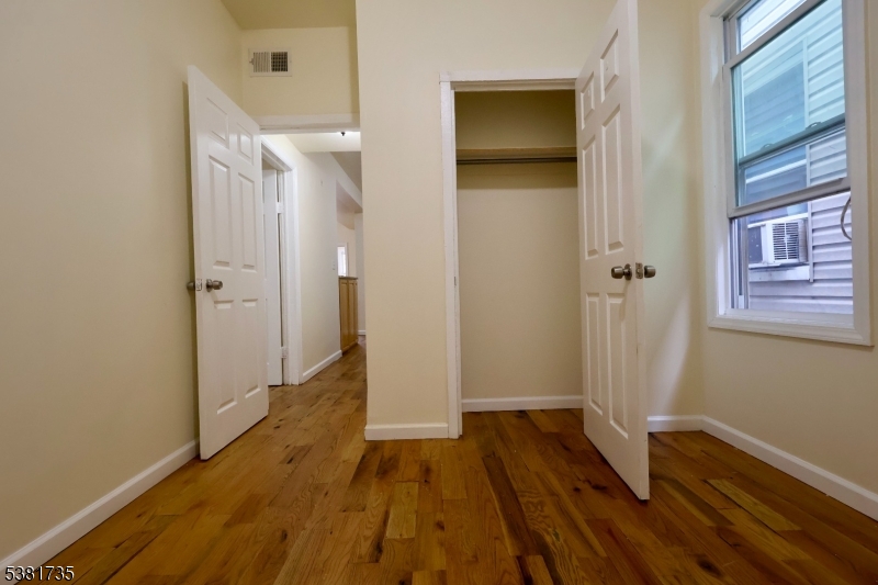 112 Chadwick Avenue, Unit 2 Newark, NJ 07108 - Photo 13 of 13 a view of a room with wooden floor and a bathroom
