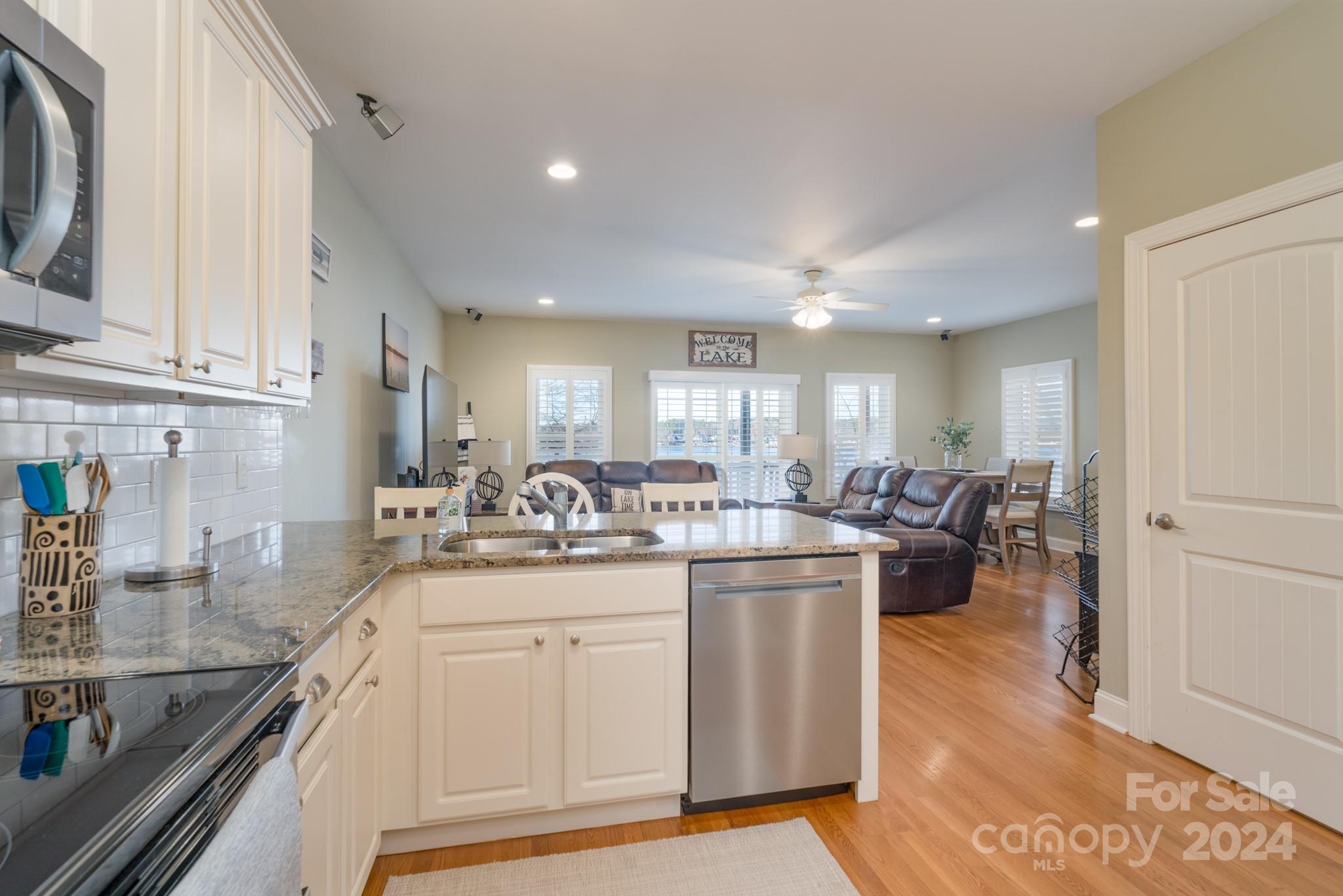 638 Deerfield Road Mount Gilead, NC 27306 - Photo 11 of 48 a kitchen with sink stove and cabinets