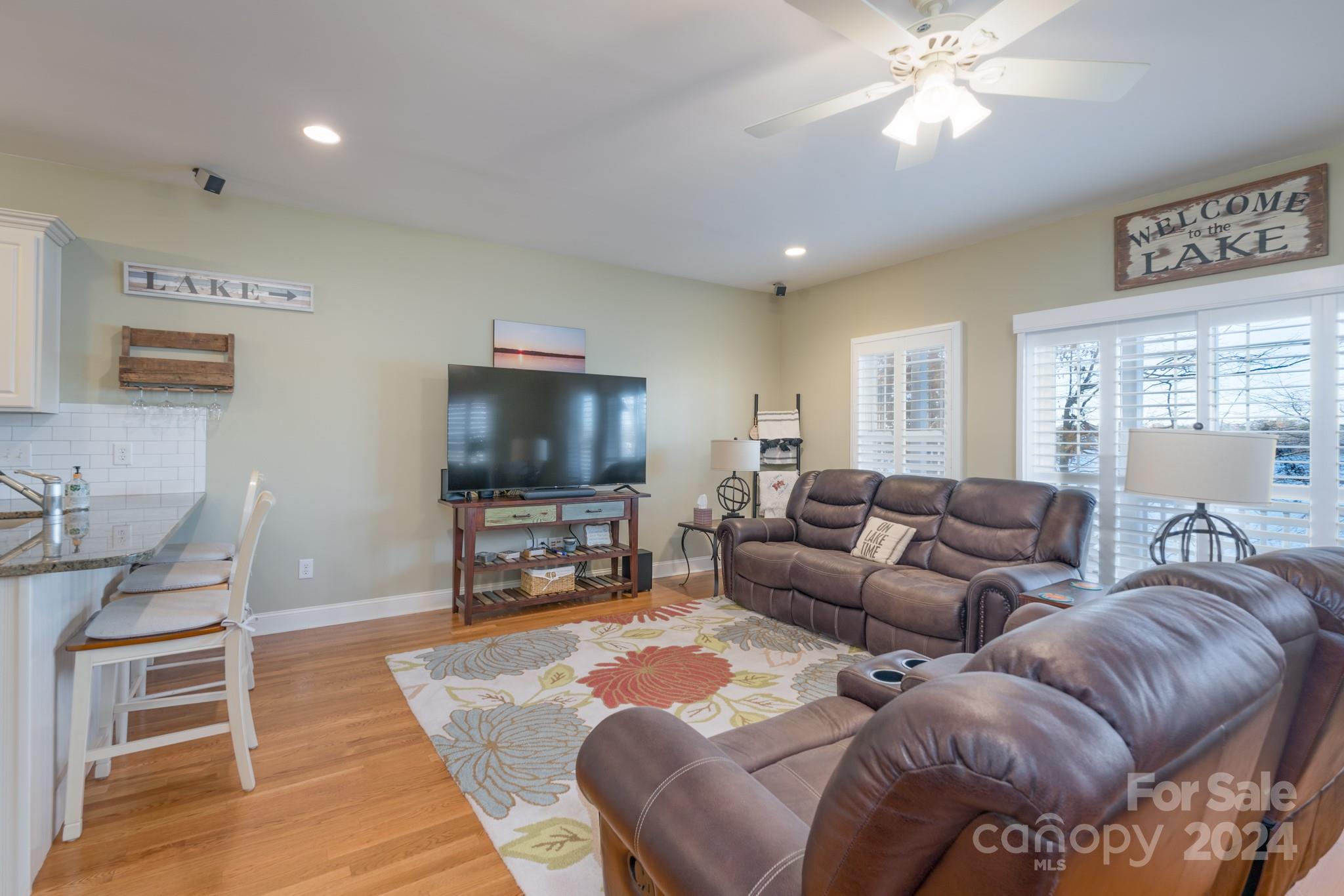 638 Deerfield Road Mount Gilead, NC 27306 - Photo 12 of 48 a living room with furniture and a flat screen tv