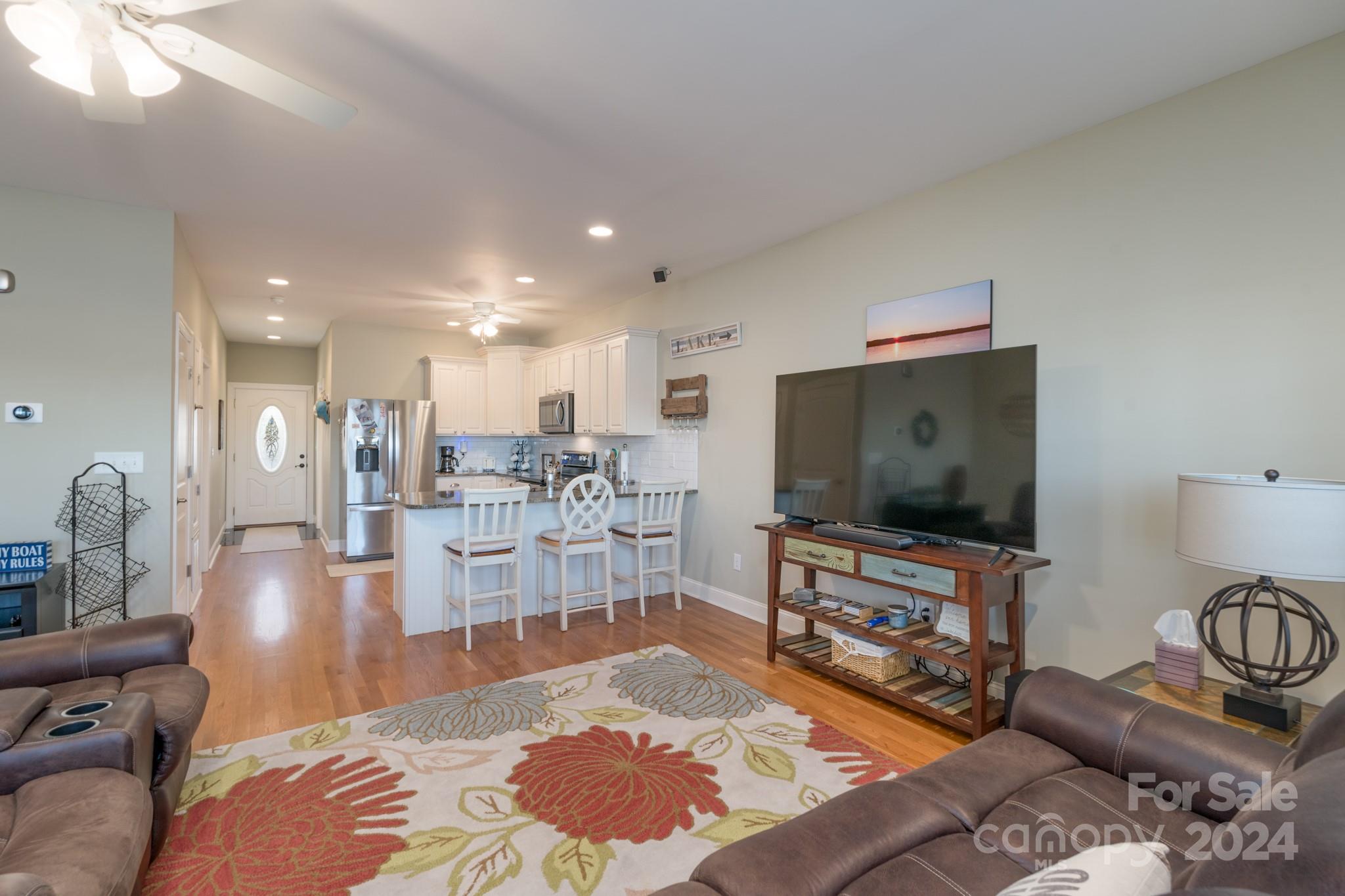 638 Deerfield Road Mount Gilead, NC 27306 - Photo 13 of 48 a living room with furniture and a flat screen tv