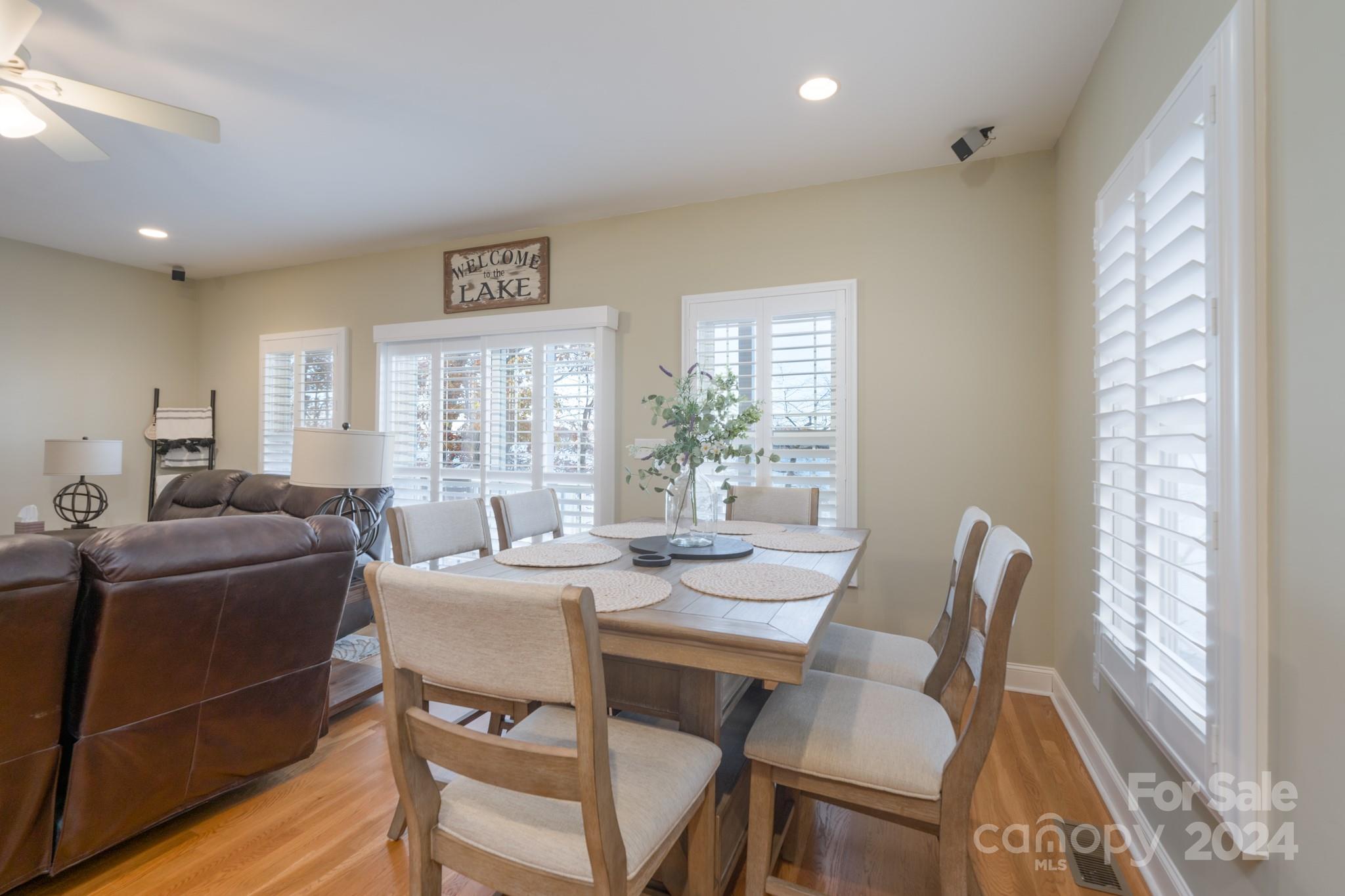 638 Deerfield Road Mount Gilead, NC 27306 - Photo 15 of 48 a view of a dining room with furniture wooden floor and a rug