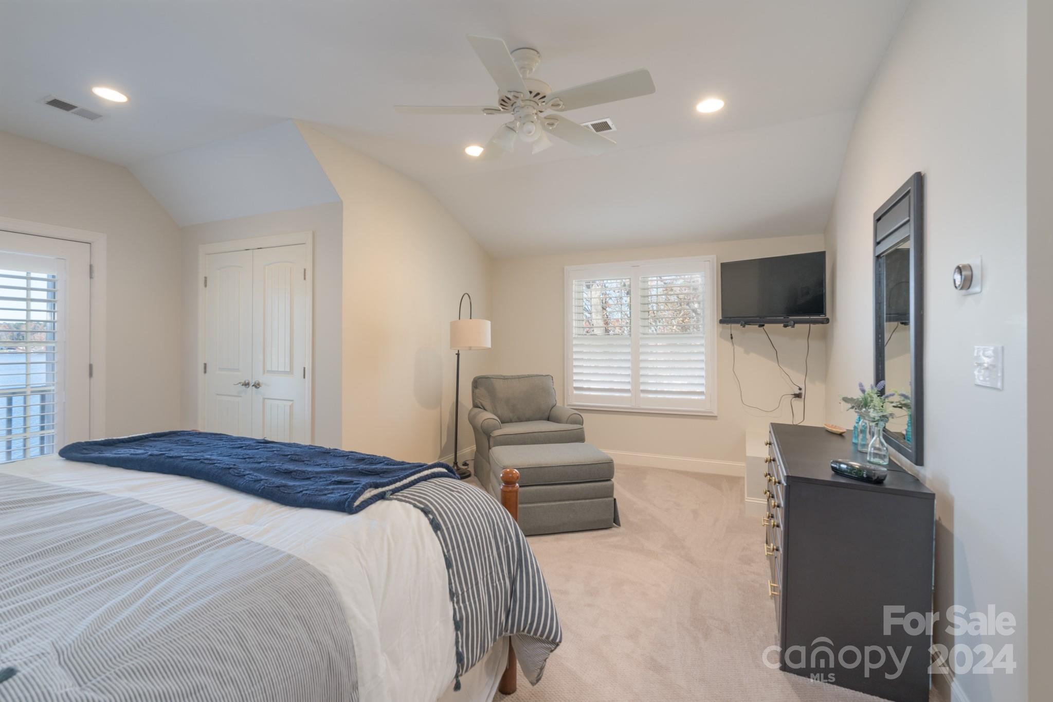638 Deerfield Road Mount Gilead, NC 27306 - Photo 19 of 48 a bedroom with a large bed couch and a window