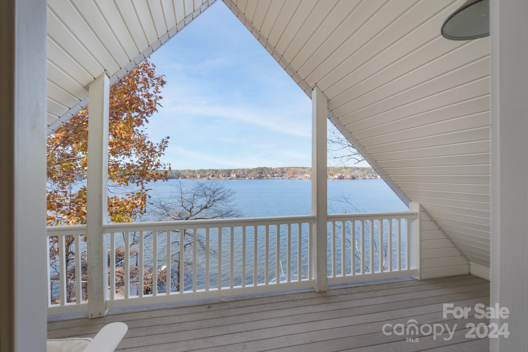 638 Deerfield Road Mount Gilead, NC 27306 - Photo 24 of 48 a view of a balcony with wooden floor and fence