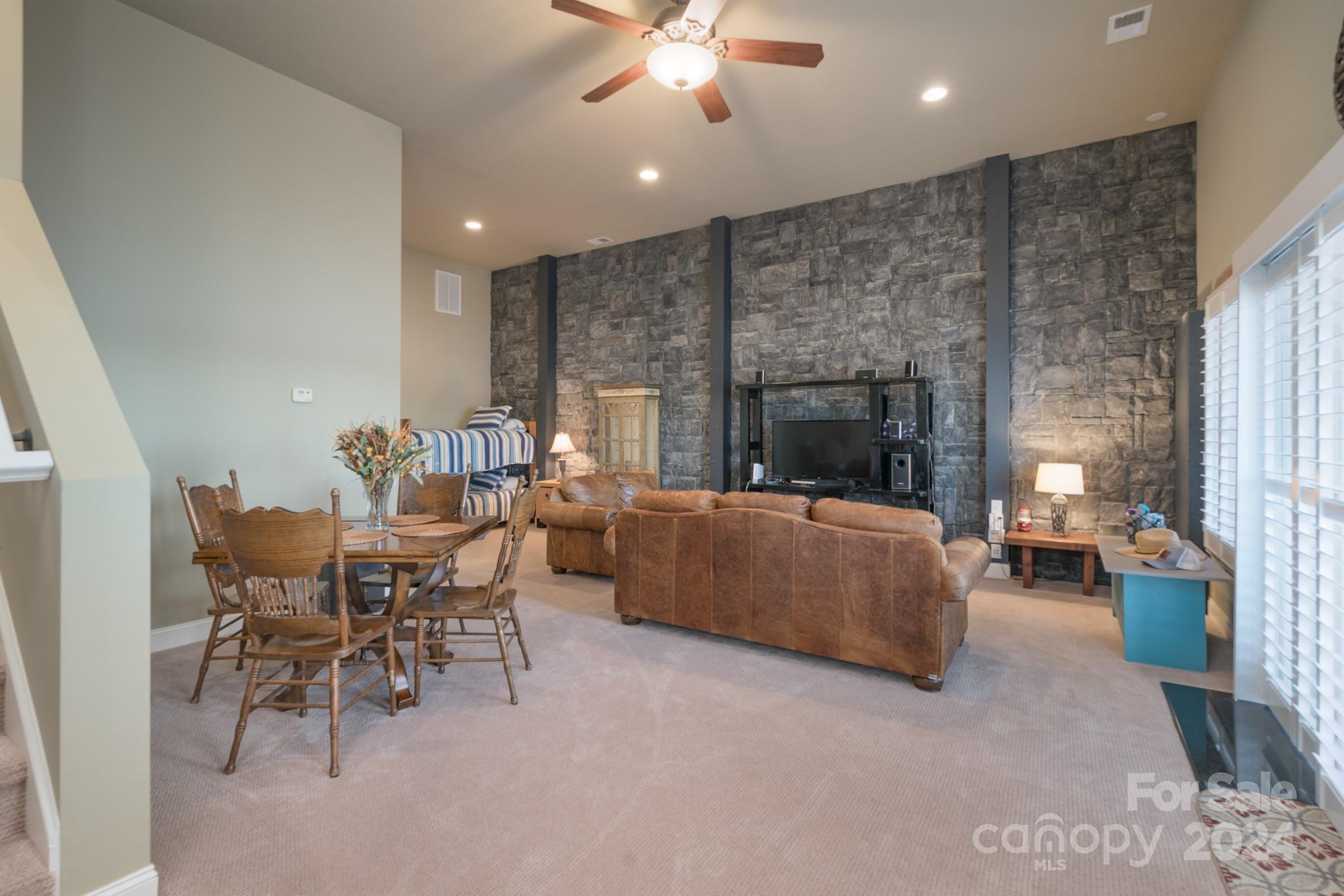 638 Deerfield Road Mount Gilead, NC 27306 - Photo 27 of 48 a living room with furniture and a fireplace