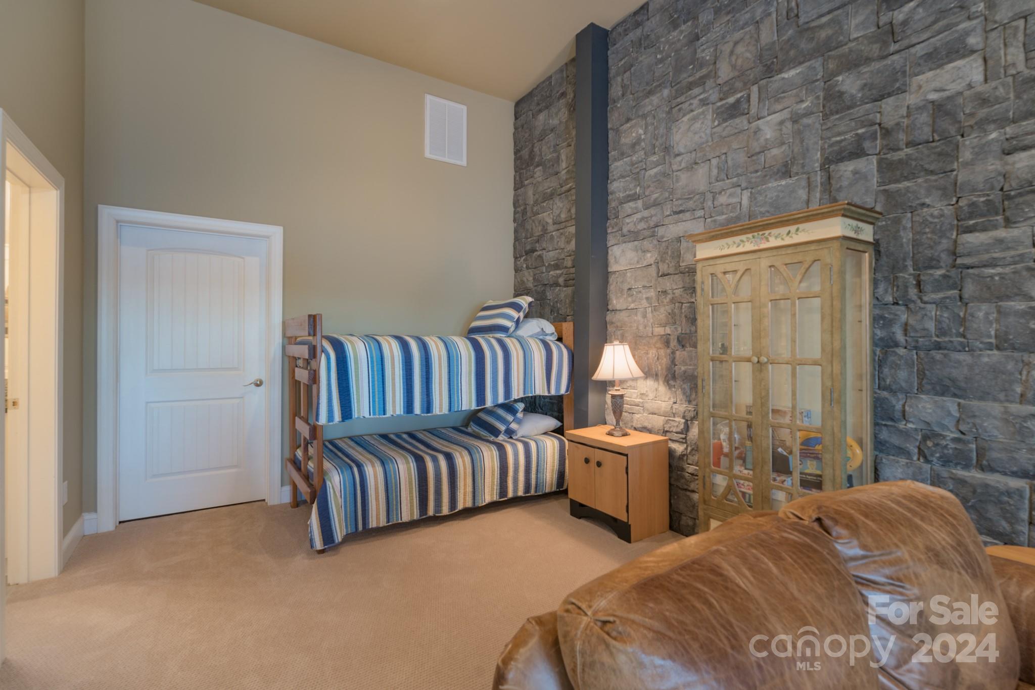 638 Deerfield Road Mount Gilead, NC 27306 - Photo 31 of 48 a bedroom with a bed and a couch