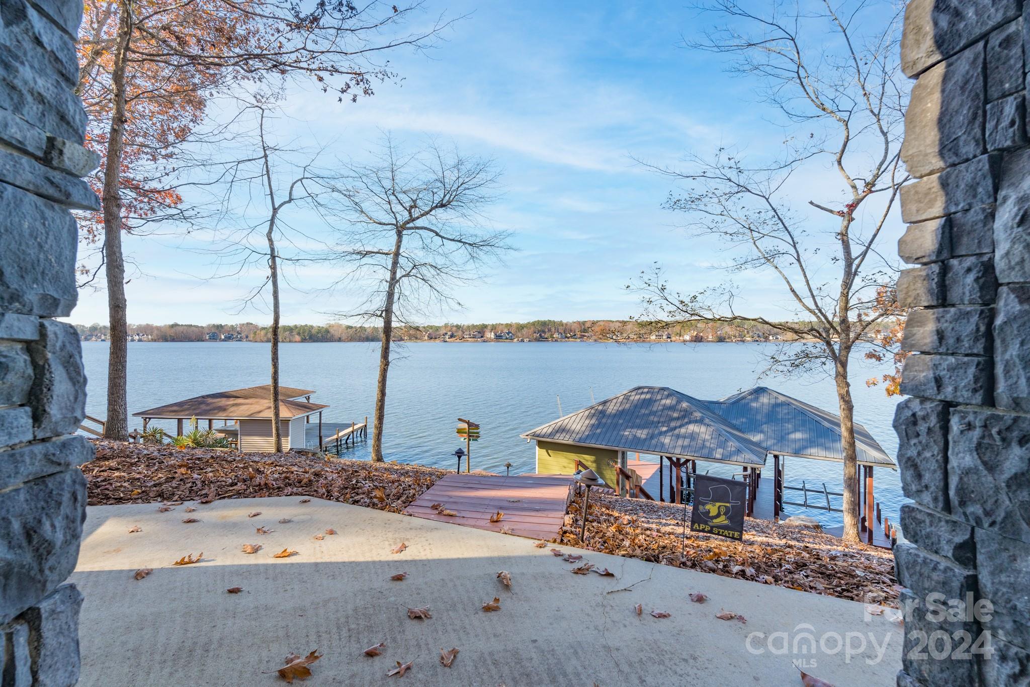 638 Deerfield Road Mount Gilead, NC 27306 - Photo 4 of 48 a view of a backyard with a lake view and sitting space