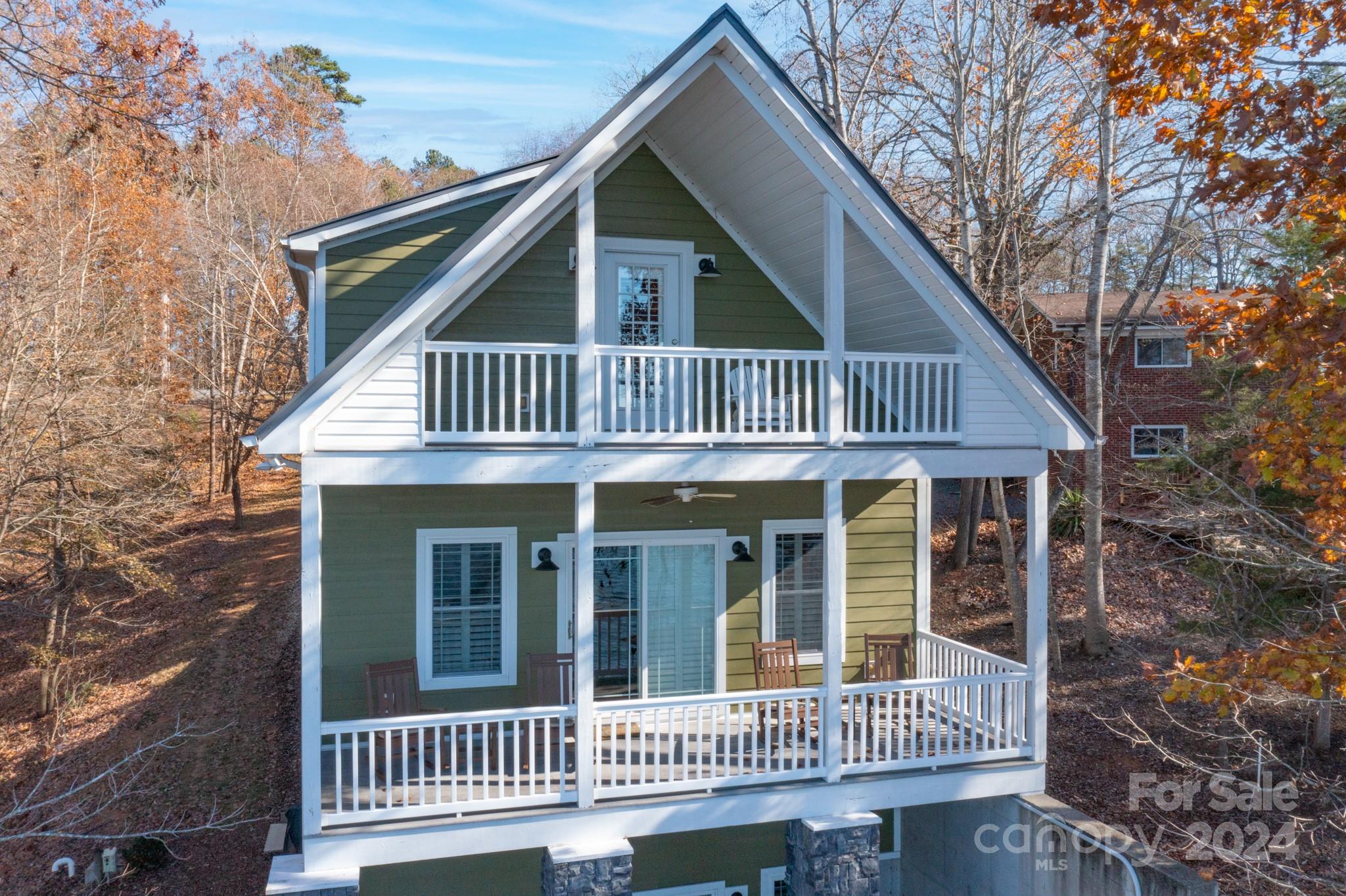 638 Deerfield Road Mount Gilead, NC 27306 - Photo 44 of 48 a view of a house with a deck and a yard