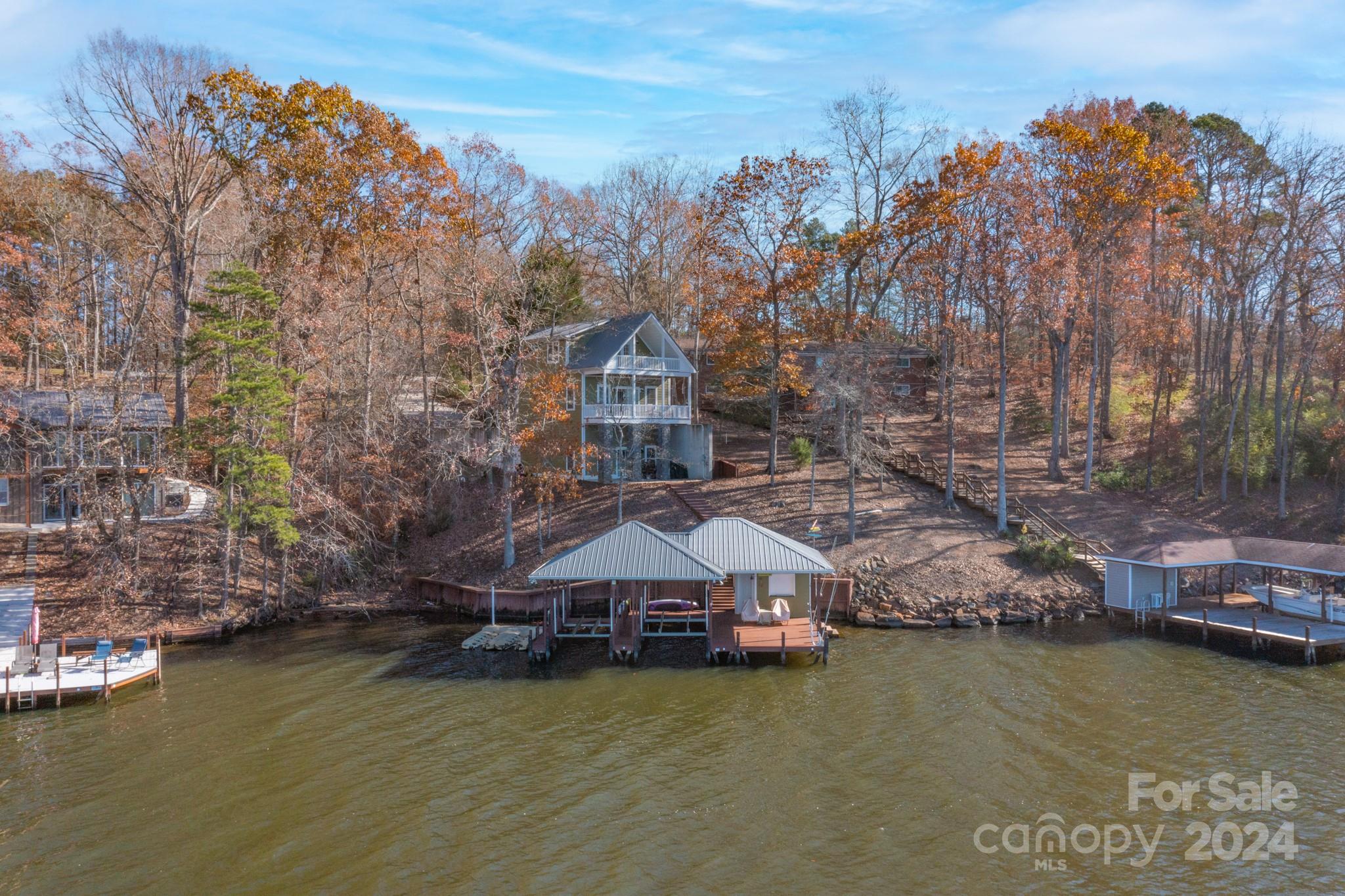 638 Deerfield Road Mount Gilead, NC 27306 - Photo 46 of 48 a aerial view of a house with a garden and lake view