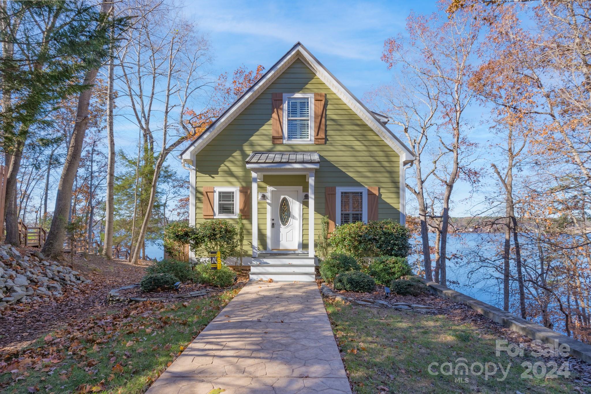 638 Deerfield Road Mount Gilead, NC 27306 - Photo 5 of 48 a front view of a house with garden
