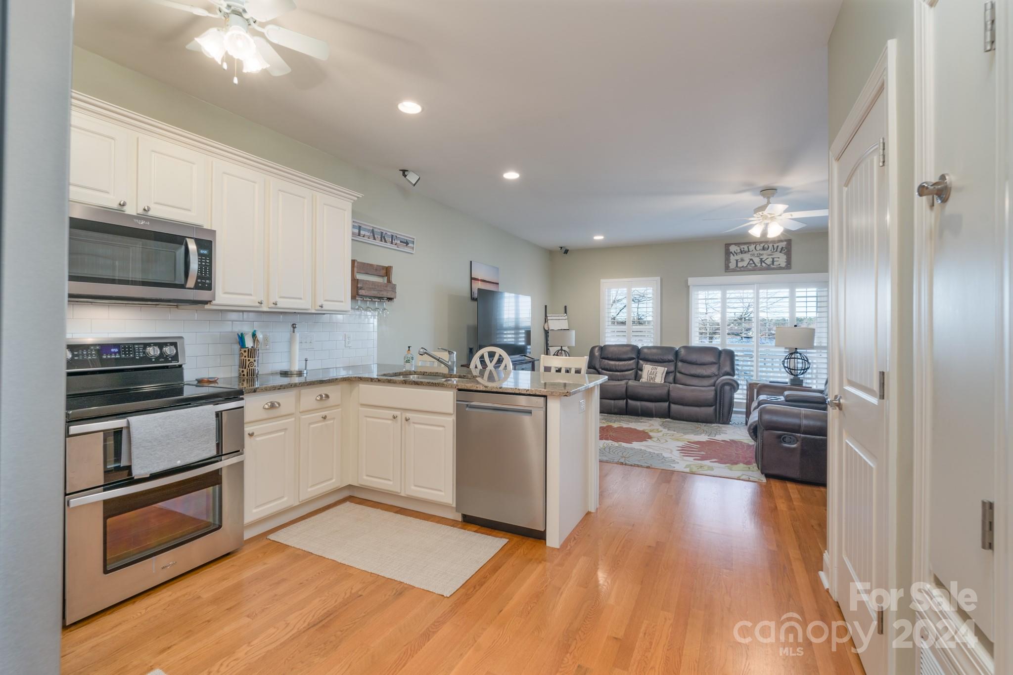 638 Deerfield Road Mount Gilead, NC 27306 - Photo 8 of 48 a kitchen with a sink stainless steel appliances and cabinets