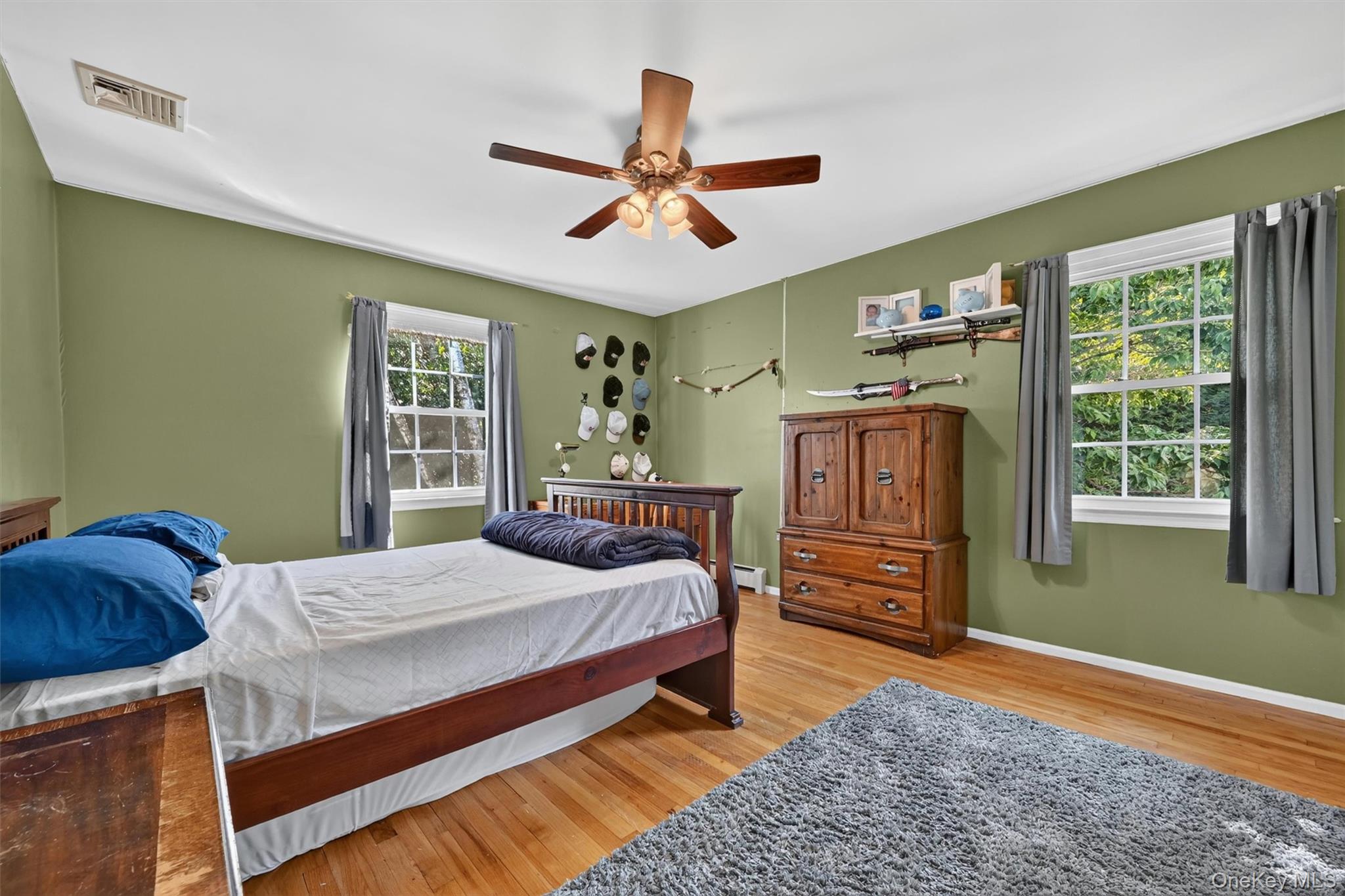 5 Hedges Road Warwick, NY 10990 - Photo 31 of 48 This spacious bedroom features hardwood floors, two windows, and a comfortable layout that can easily adapt to different needs.