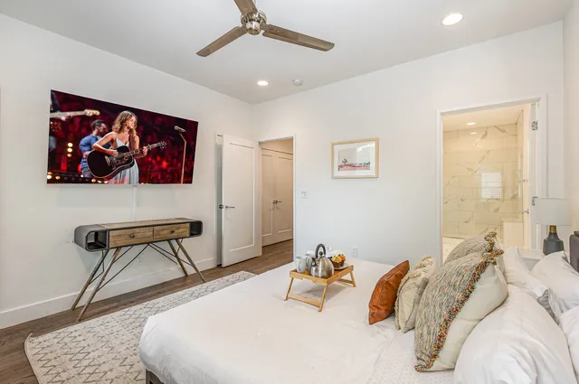 a bedroom with a bed and a chair