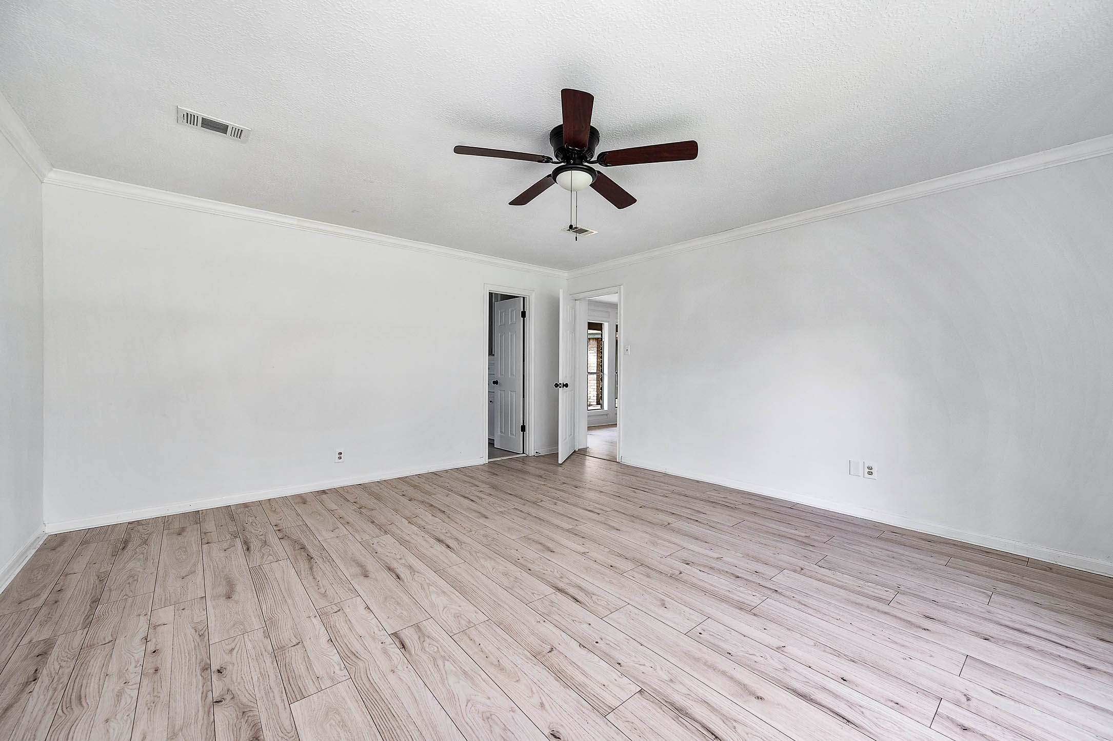 17627 Terrawren Lane Spring, TX 77379 - Photo 20 of 30 a view of empty room with wooden floor and ceiling fan
