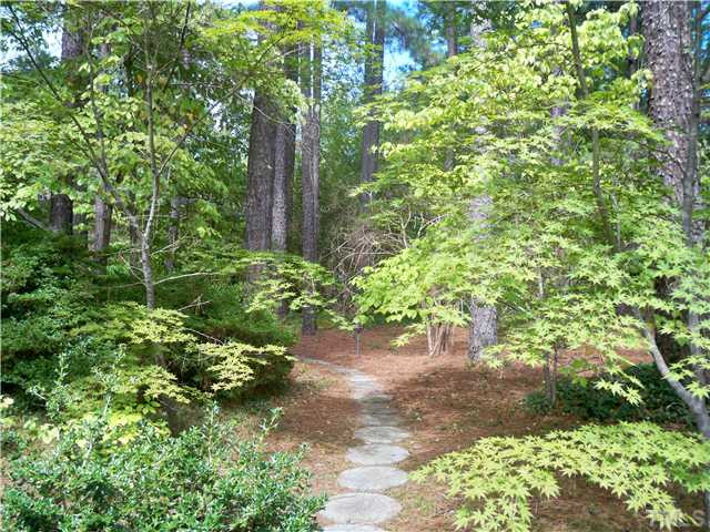 3506 Rugby Road Durham, NC 27707 - Photo 7 of 8 This is the walk way leading to the home. Mature hardwood trees and landscaping provide a quiet oasis.