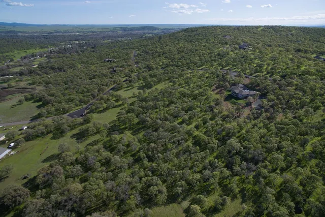 a view of a field with an outdoor space