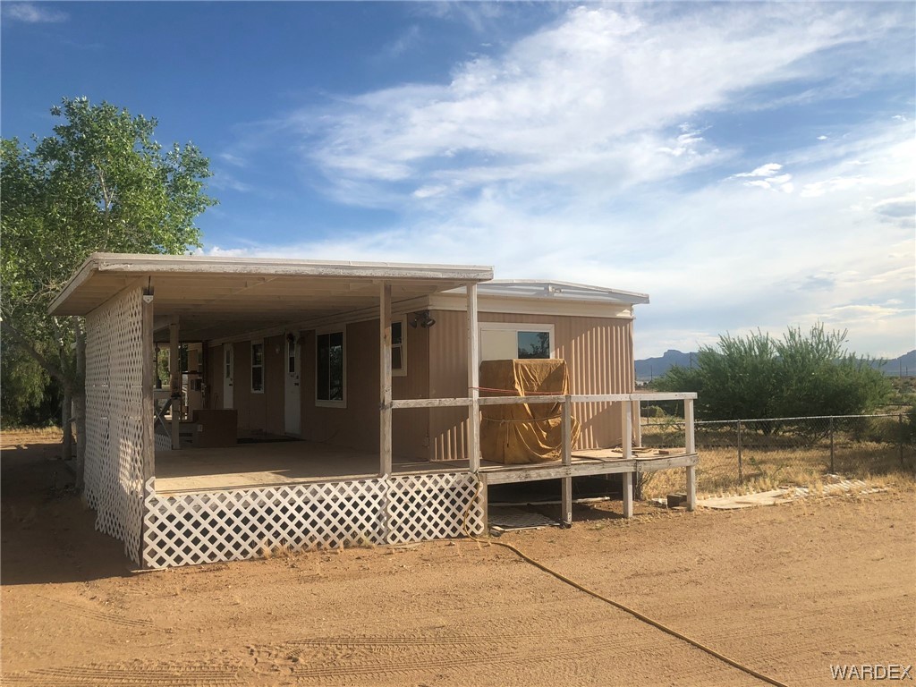3617 Salt Road Golden Valley, AZ 86413 - Photo 2 of 22 a view of a house with a backyard
